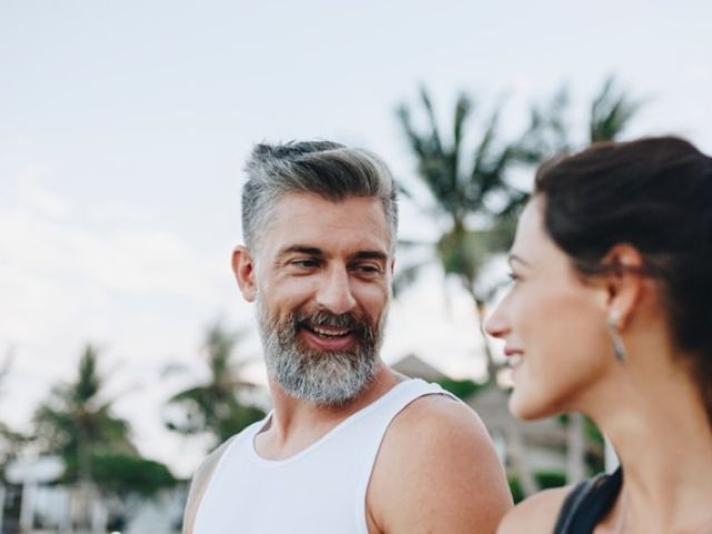 How Creatine Became an Anti-Aging and Longevity Essential 8 A middle-aged man with healthy cholesterol levels smiles at his partner.