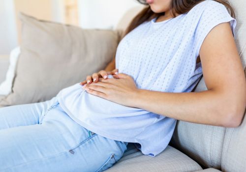 Homepage 77 A woman with bloating after her workout