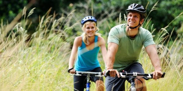Homepage 20 Couple riding bikes on a country path